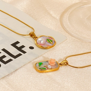 Detailed macro view of vintage oil painting pendants with floral patterns and pearls