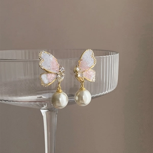 Elegant gold butterfly earrings with gradient pink inlay, sparkling crystals and pearls