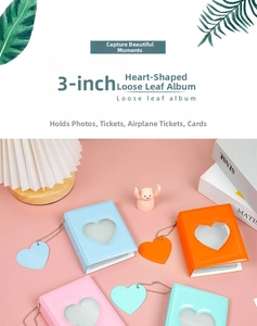 Detail of 3-inch hollow heart album with loose-leaf binding and matching heart pendant