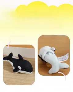 Detailed view of orca plush toy with functional bottom opening and soft plush texture