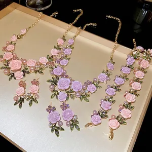 Floral jewelry set with pink roses, pearls and crystals including necklace and earrings