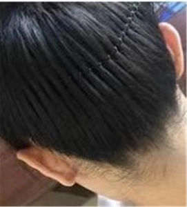 Detailansicht der nahtlosen schwarzen Haarverlängerung mit Clip-In-Kamm für Volumen
