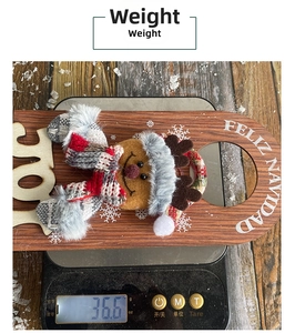 Close-up of a Christmas door hanger showing weight measurement and plush reindeer detail