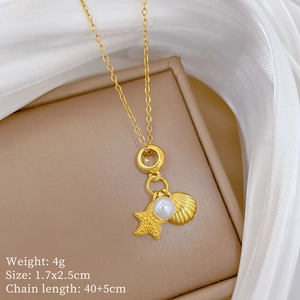 Close-up of gold starfish and pearl pendant with specifications for weight and length
