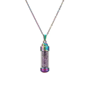 Macro detail of rainbow stainless steel perfume bottle necklace with purple amethyst stones