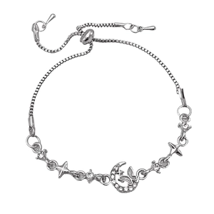 Detail of silver box chain bracelet featuring celestial star, moon, and butterfly charms