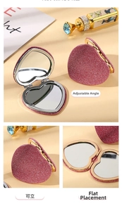 Detail view of heart-shaped glitter makeup mirror with adjustable stand and folding design