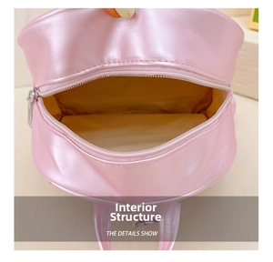 Macro shot of the spacious inner compartment and lining of this pink girl's backpack