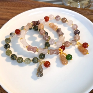 Colorful natural stone beaded bracelets with gourd charms and golden spacers