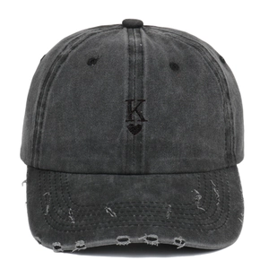 Washed vintage baseball cap with K heart embroidery and distressed brim details