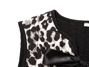 Close-up of leopard print top with black satin bow tie and size S collar tag