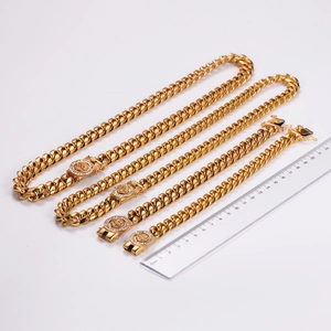 Golden lion head clasp Cuban chain necklaces and bracelets with ruler for size reference
