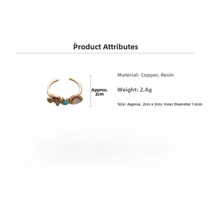 Detailed specs of vintage resin ring with gold bird motif and turquoise bead