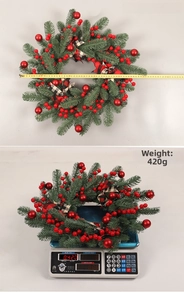 Close-up of 50cm Christmas berry wreath showing measurement of weight and diameter