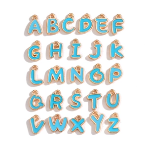 Top view of 26 blue enamel gold-plated alphabet charms set A-Z for DIY jewelry