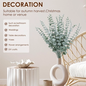 Artificial grey-green eucalyptus stems in a ceramic vase for home and wedding decor