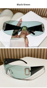 Detail view of Y2K rimless sunglasses with green lenses and diamond-set temple accents
