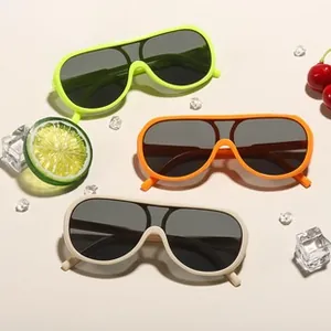 Summer vibes with oversized neon heart sunglasses in green, orange and beige colors