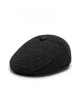Detail view of winter dark grey plaid ivy cap showing thick wool blend fabric texture