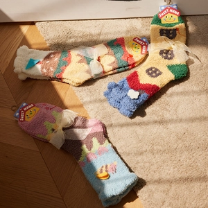 Three pairs of thick coral fleece socks with cute cartoon embroidery and ribbon gift wrap