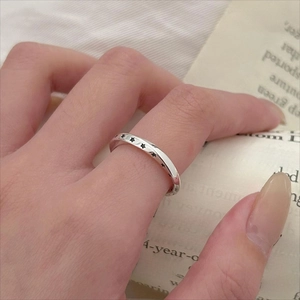 Close-up of vintage 925 sterling silver ring with hollow star design worn on a hand