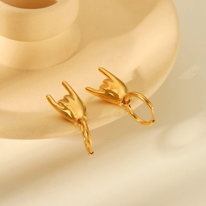 Light luxury gold titanium steel hoop earrings featuring creative rock gesture pendants