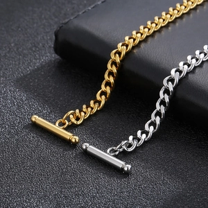 Detailed close-up of OT toggle clasp on gold and silver stainless steel chain bracelets