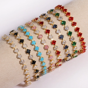 Macro shot of colorful square-cut zircon bracelets on a cylindrical jewelry display stand