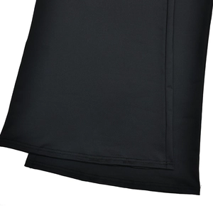 Close-up of black fabric texture with high-quality double-needle stitching and hem details