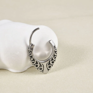 Vintage silver stainless steel hoop earring with engraved wave pattern on white stone