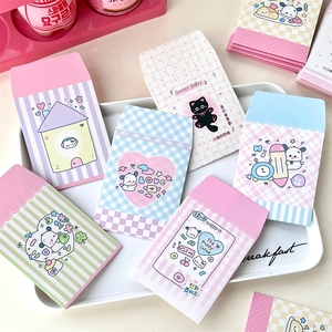 Macro shot of colorful cartoon mini envelopes in pink and mint for idol photo cards