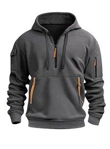 Detail of grey hoodie showing arm zipper pocket and orange leather zipper puller detail