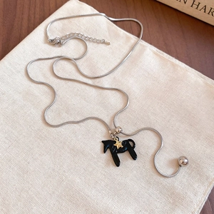 Vintage silver snake chain necklace with black horse pendant and gold star accent