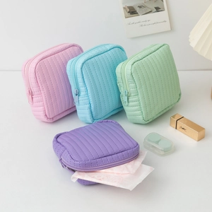 Pastel quilted leather mini organizer bags in pink blue green and purple with zipper