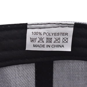 Macro detail of washing label and stitching on 100% polyester hip-hop baseball cap