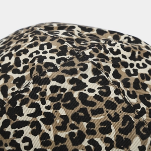 Detailed close-up showing leopard print fabric texture and reinforced cross stitching