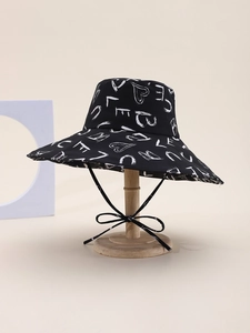 Black wide-brim sun hat featuring white heart patterns and adjustable windproof strap