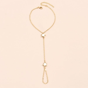 Detail of 14K gold star anklet with lobster clasp and two white star charms on a thin chain