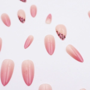 Pink gradient almond press-on nails with stylish leopard patterns for summer look