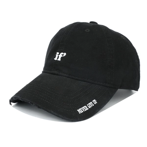 Detail of white if and NEVER GIVE UP embroidery on a black cotton baseball cap