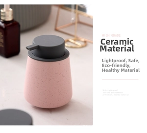 Detail of pink matte ceramic soap dispenser with black speckles and grey pump head