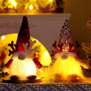 Light-up Christmas Gnomes with sequins and glowing horns for festive tabletop decoration