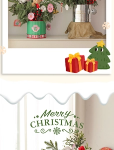 Close-up of a Christmas tree tabletop decoration with red berries and a cute plush bear