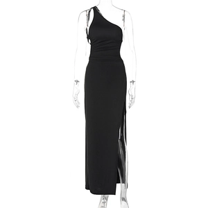 Detail of side slit and waist ruching on a black one-shoulder slim fit maxi dress