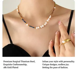 Detail of bohemian necklace with freshwater pearls and 18K gold plated beads on model