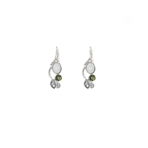 Detail view of silver drop earrings with turquoise stones and shimmering crystals