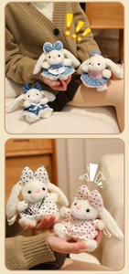 Close-up of plush rabbit pendants in various lace dresses and colorful polka dot skirts