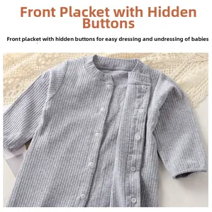 Detail of light grey ribbed cotton baby romper featuring snap button closure and soft fabric
