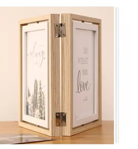 Close-up of a 5x7 inch double-sided rotating wooden photo frame with silver metal hinges