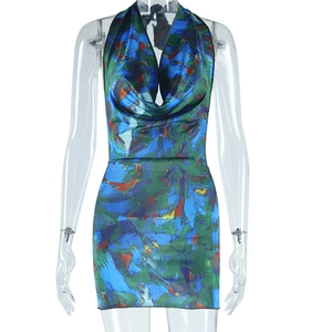 Detail of cowl neck and abstract blue-green art print on slim-fit halter dress